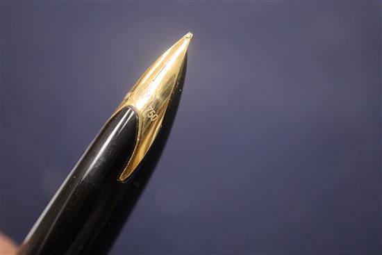 A group of five vintage fountain pens, including a Watermans orange and black marble effect pen